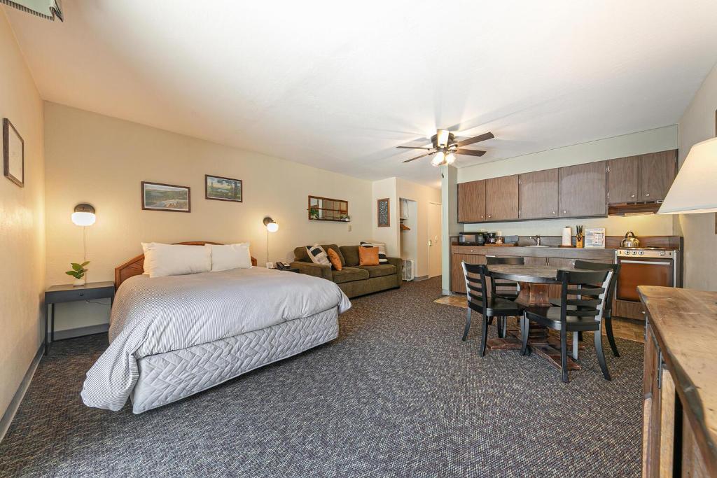 a large bedroom with a bed and a kitchen at Beautiful Studio W/Kitchenette #134 at Donner Lake Village in Truckee