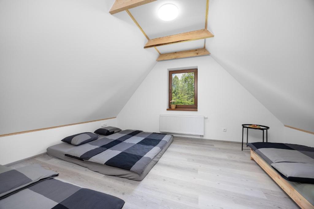 Postel nebo postele na pokoji v ubytování MERTLIN Resort