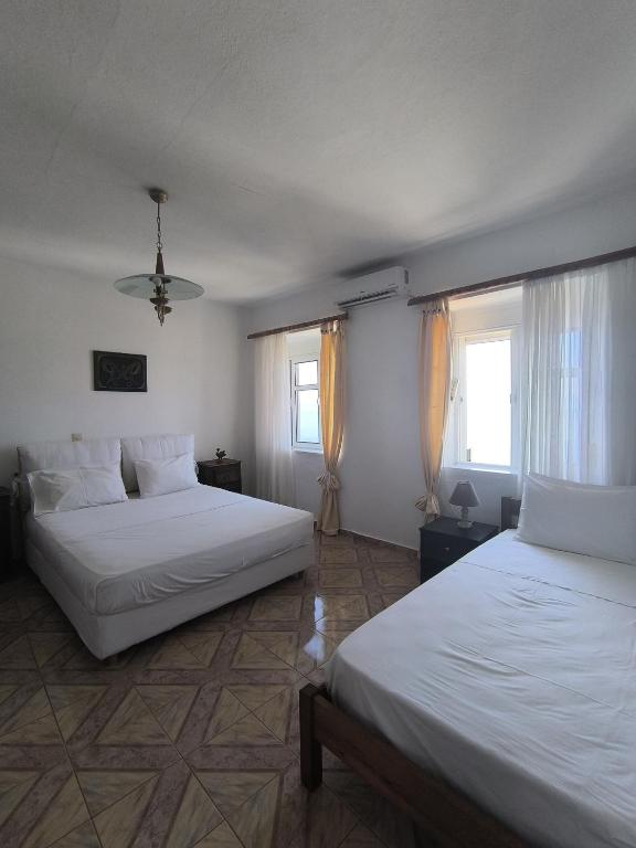 Postel nebo postele na pokoji v ubytování Q Bay Apartments