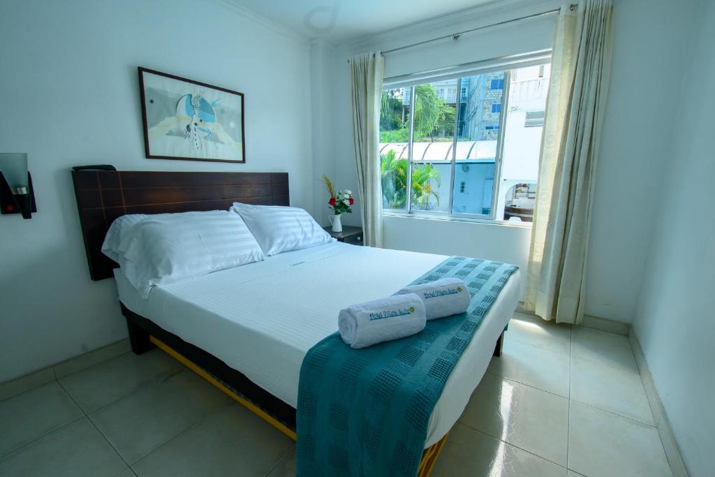 Postel nebo postele na pokoji v ubytování Hotel Villeta Suite SPA
