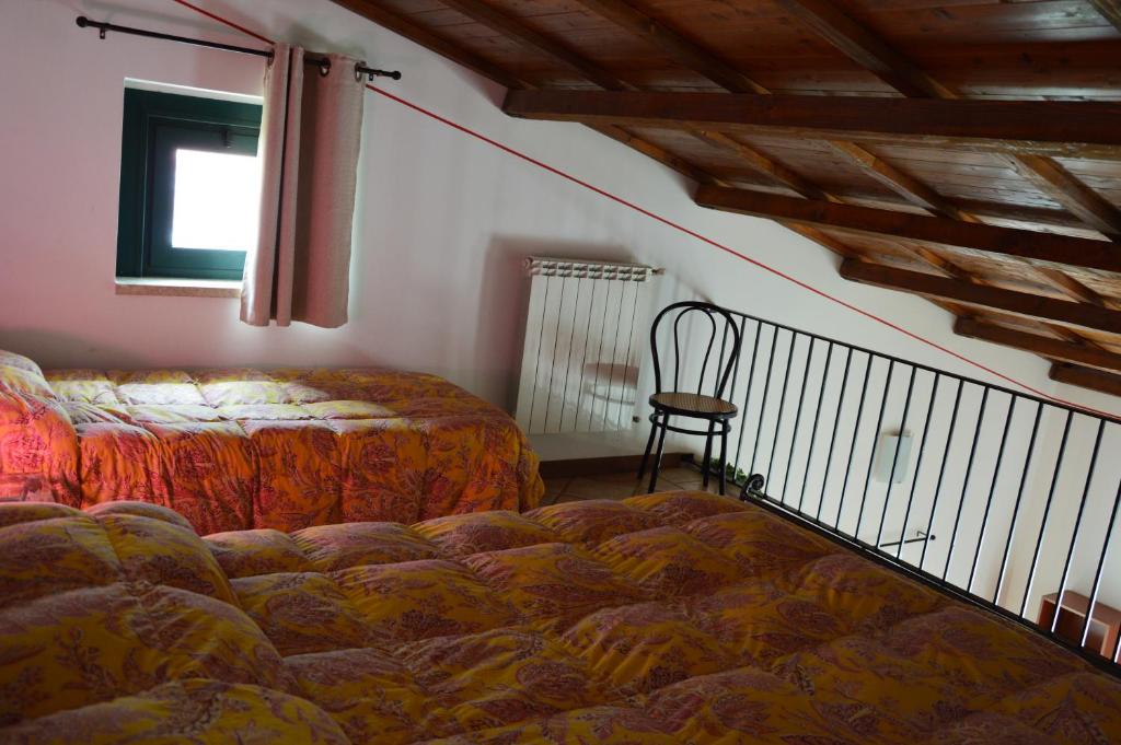 Postel nebo postele na pokoji v ubytování R&B Il Parco