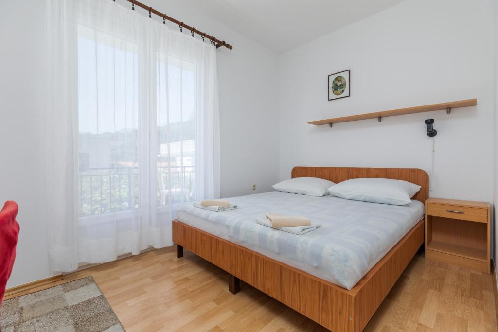 Postel nebo postele na pokoji v ubytování Apartments by the sea Podaca, Makarska - 516