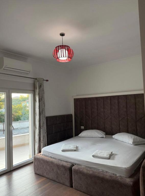 Postel nebo postele na pokoji v ubytování Apple Red Hotel