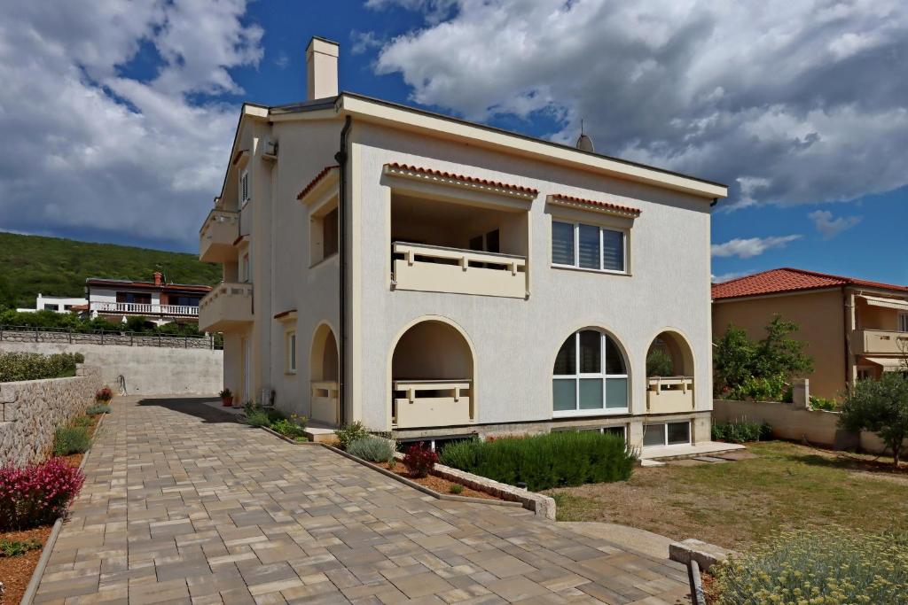 a villa with a view of a house at Apartments with parking space Punat, Krk - 20553 in Punat