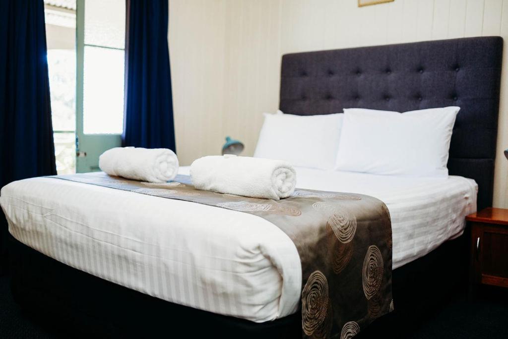 Postel nebo postele na pokoji v ubytování Maleny Hotel