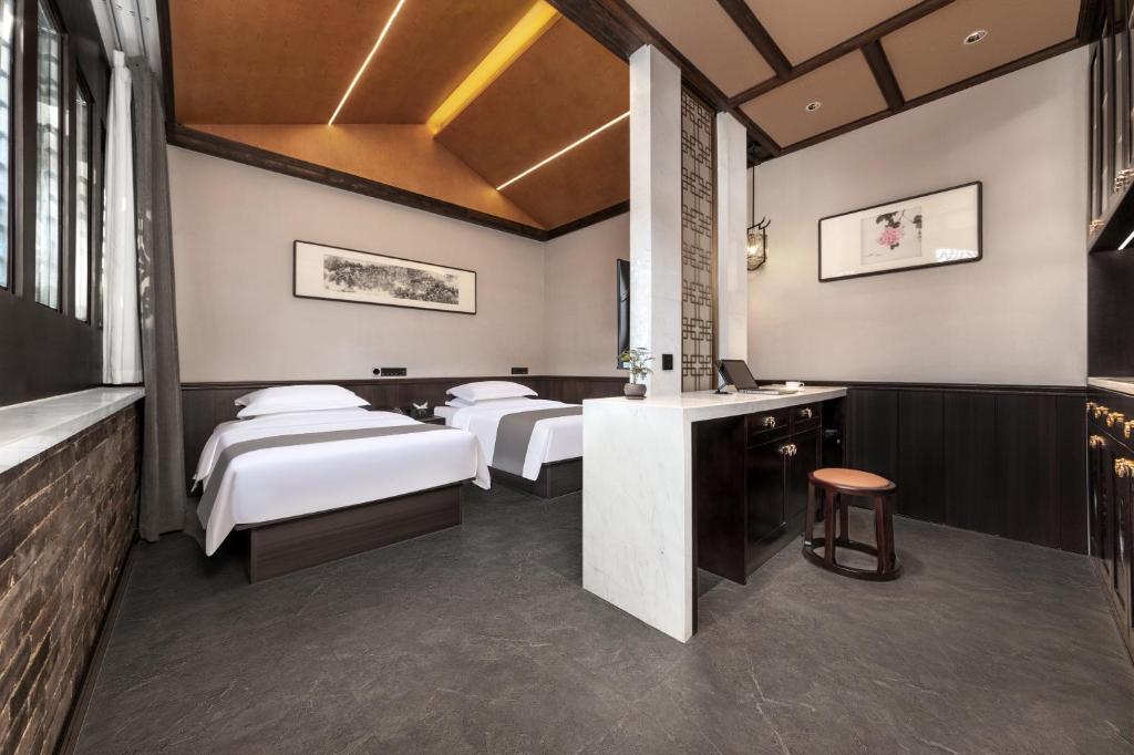 Postel nebo postele na pokoji v ubytování Tao Hotel