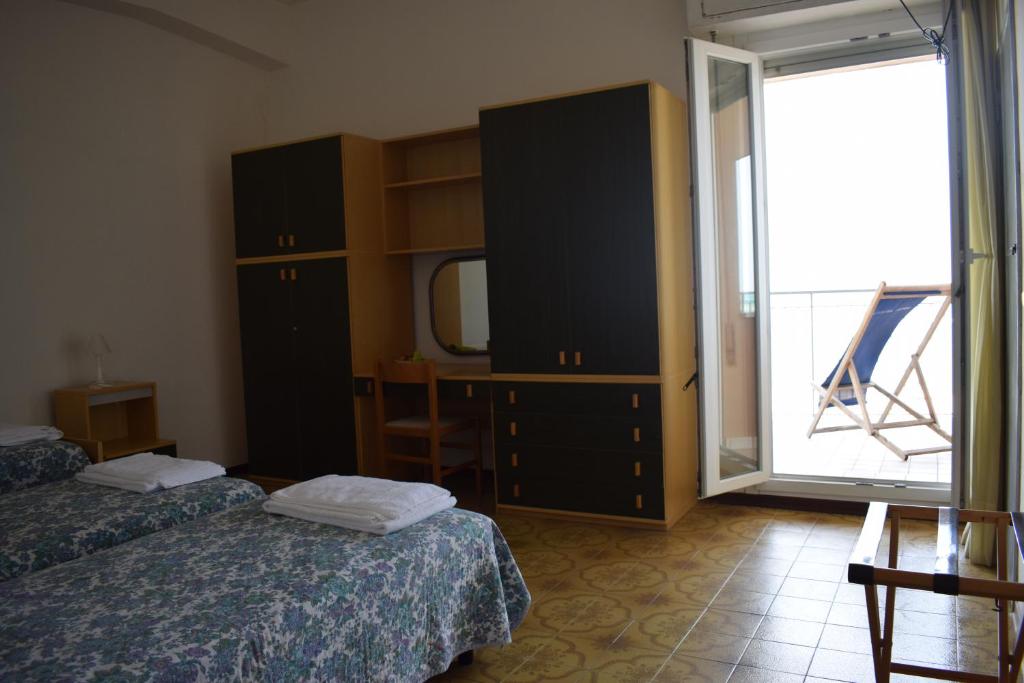 Postel nebo postele na pokoji v ubytování Hotel Astoria