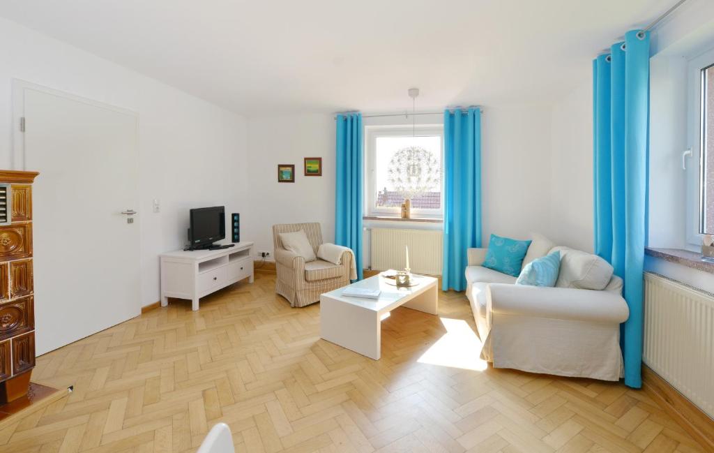 TV a/nebo společenská místnost v ubytování Ferienwohnung Hornfisch