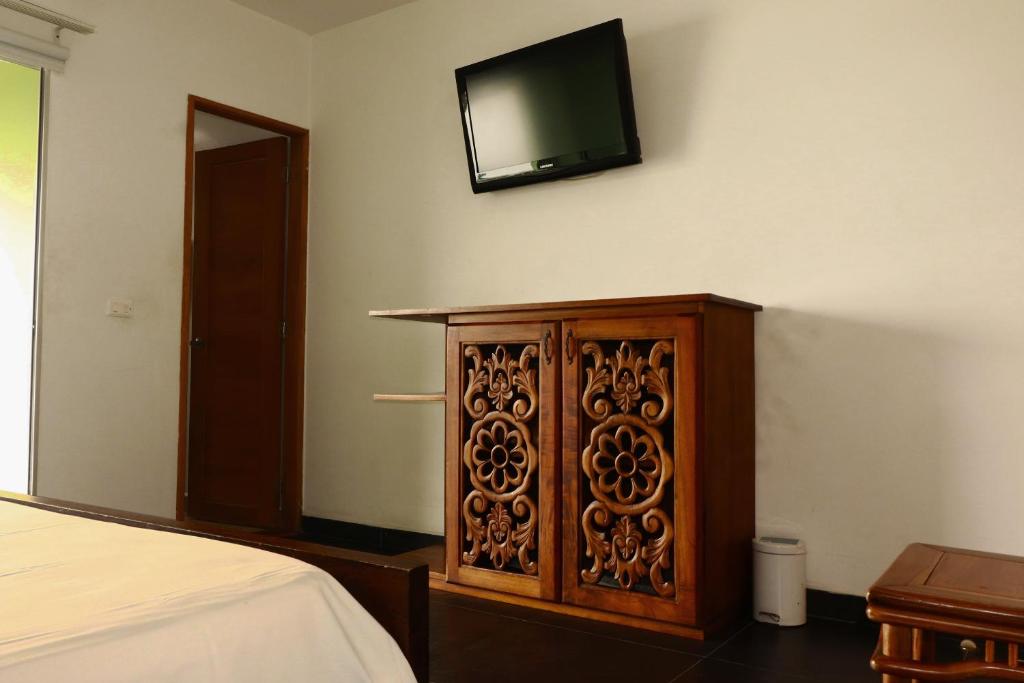 TV a/nebo společenská místnost v ubytování Hotel Portobelo Guatape