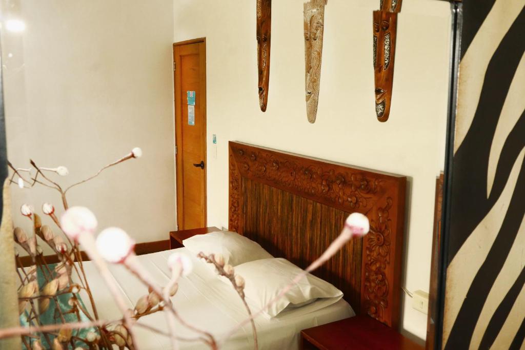 Postel nebo postele na pokoji v ubytování Hotel Portobelo Guatape