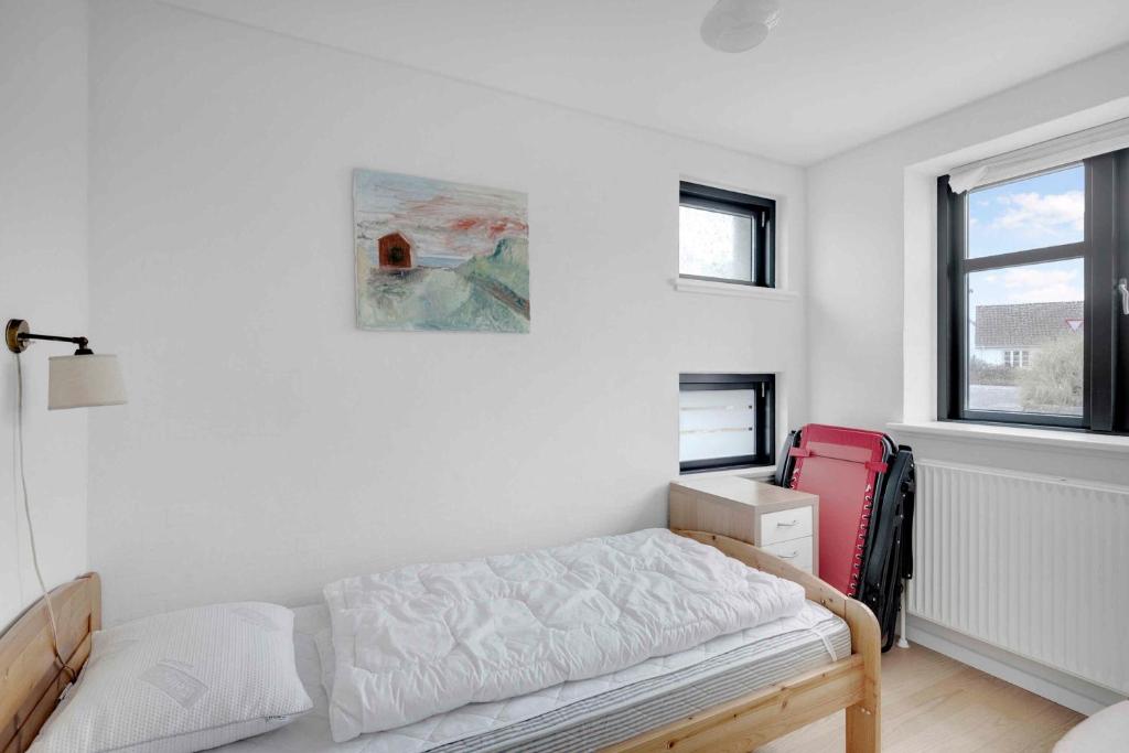 Ein Bett oder Betten in einem Zimmer der Unterkunft Beachfront Cottage With Panoramic View