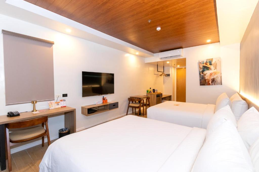 TV a/nebo společenská místnost v ubytování Levo Hotel