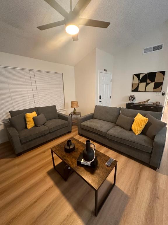 a living room with two couches and a coffee table at Sunset Serenity in Las Vegas