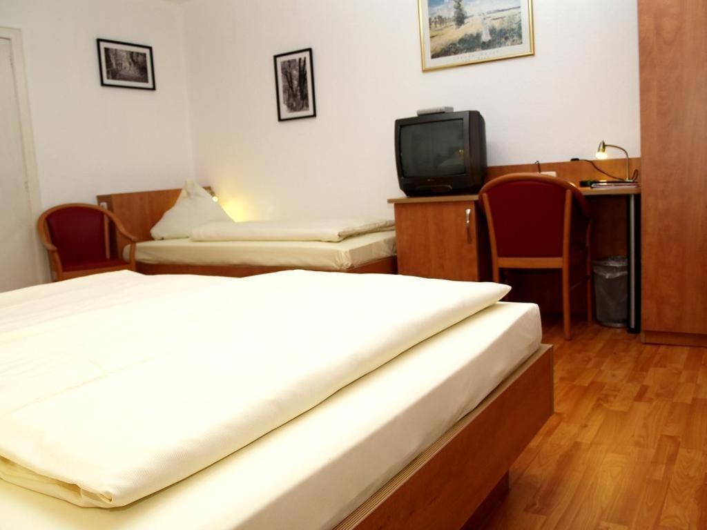Postel nebo postele na pokoji v ubytování Altstadthotel Wienecke
