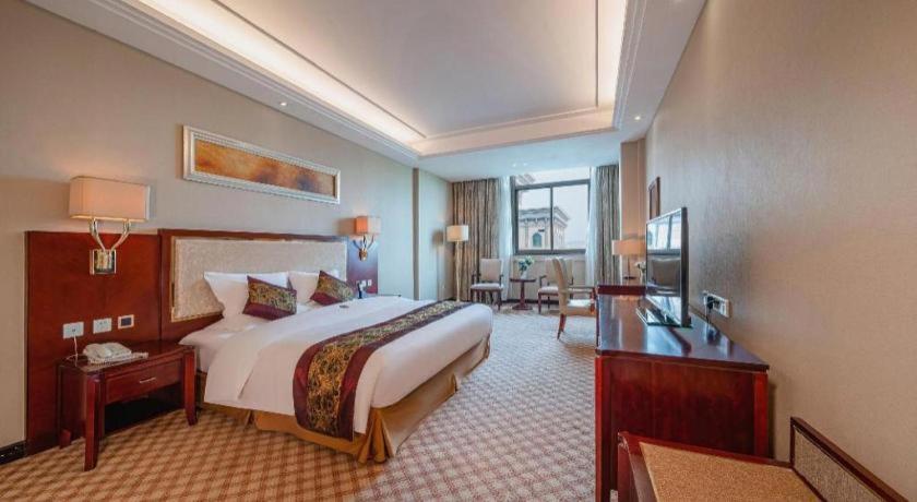 Postel nebo postele na pokoji v ubytování Nanning Yongjiang Hotel