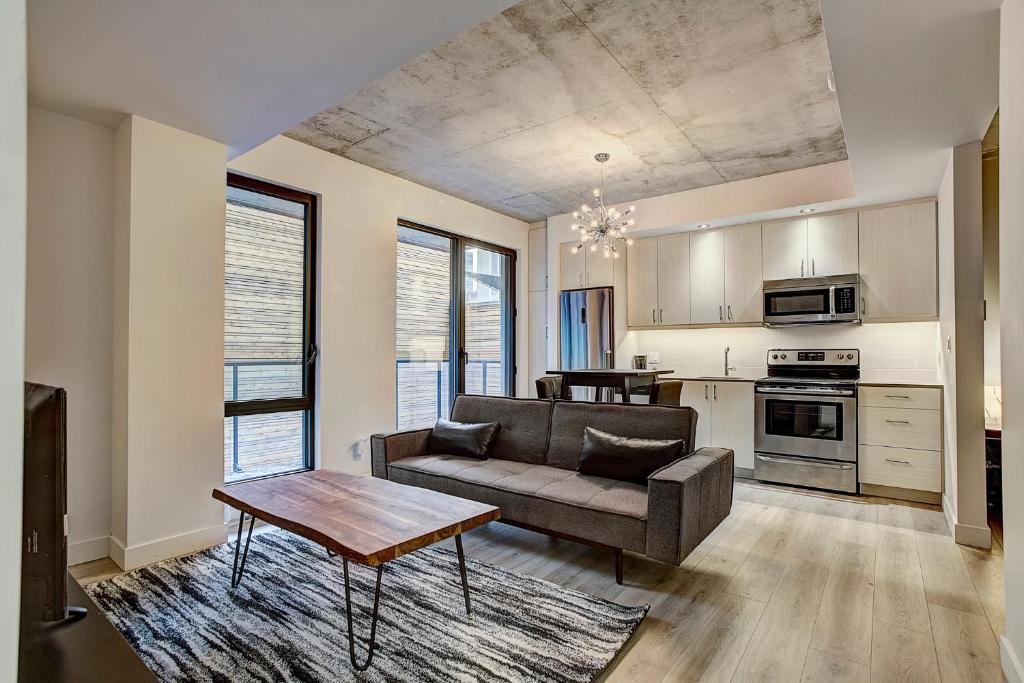 a living room with a couch and a table at The Downtown Oasis in Montréal