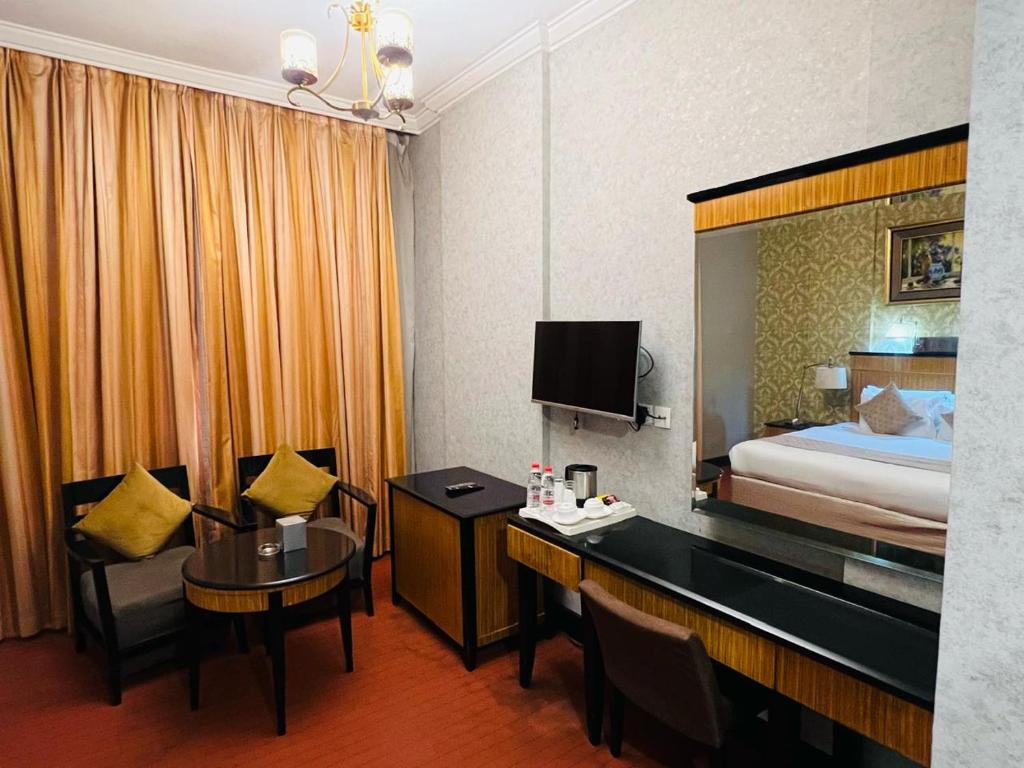 Postel nebo postele na pokoji v ubytování CREEK Hotel
