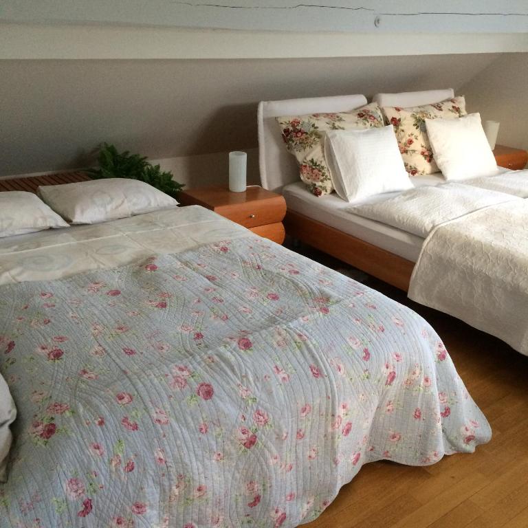 Postel nebo postele na pokoji v ubytování Guest House Vitaja