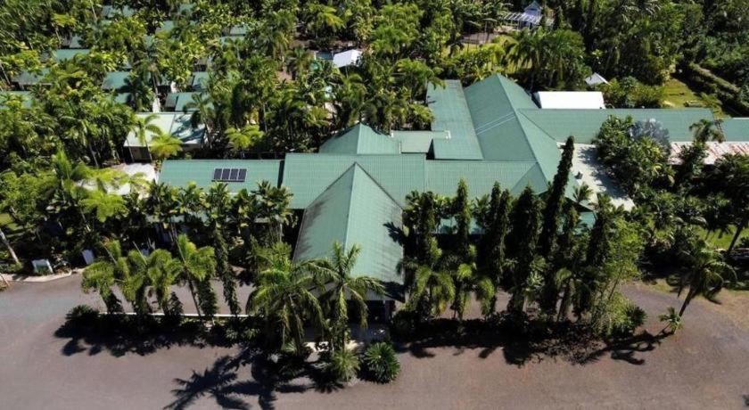 an aerial view of a house with palm trees at Orator Hotel in Apia