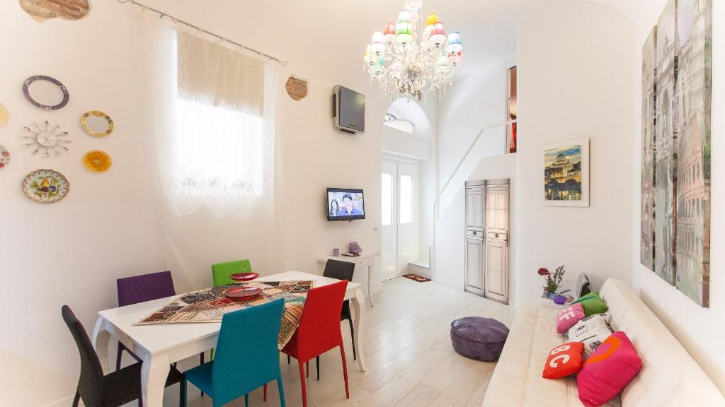 a dining room with a table and chairs at Rental in Rome Palermo apartment in Rome