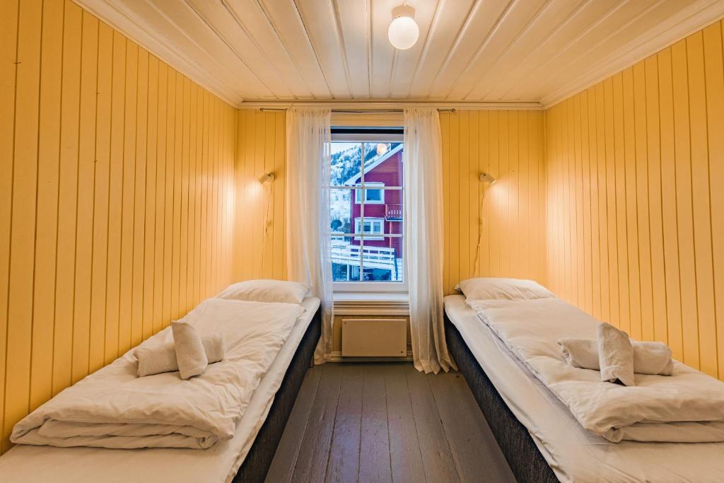 Postel nebo postele na pokoji v ubytování Fiskeværet Nesland