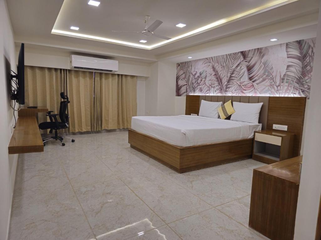 Postel nebo postele na pokoji v ubytování Ginger Ahmedabad SG Road