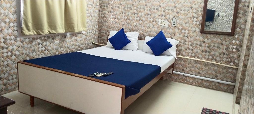 Postelja oz. postelje v sobi nastanitve Rajkumar GuestHouse