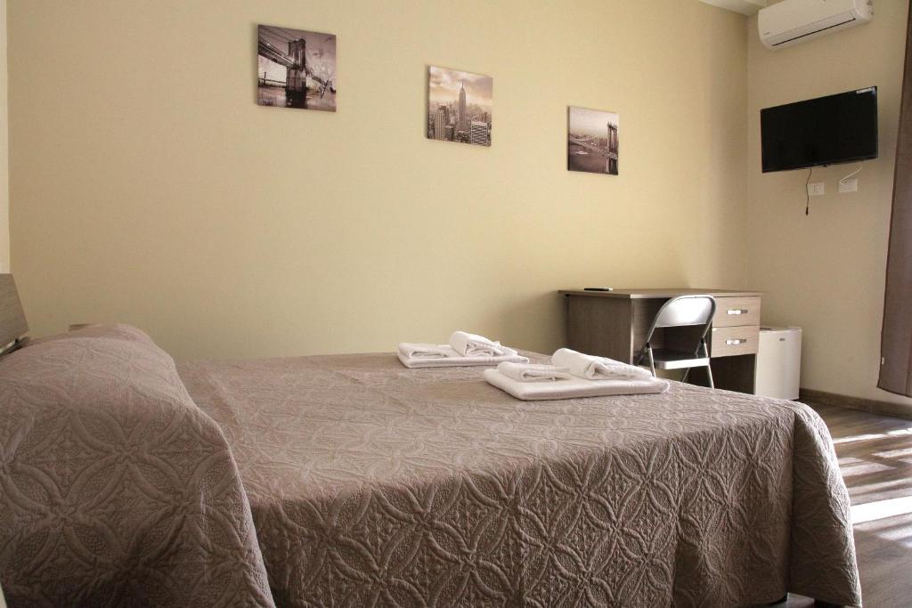 A bed or beds in a room at Affittacamere Sogni D'oro