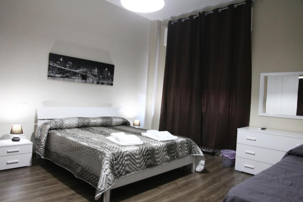 A bed or beds in a room at Affittacamere Sogni D'oro