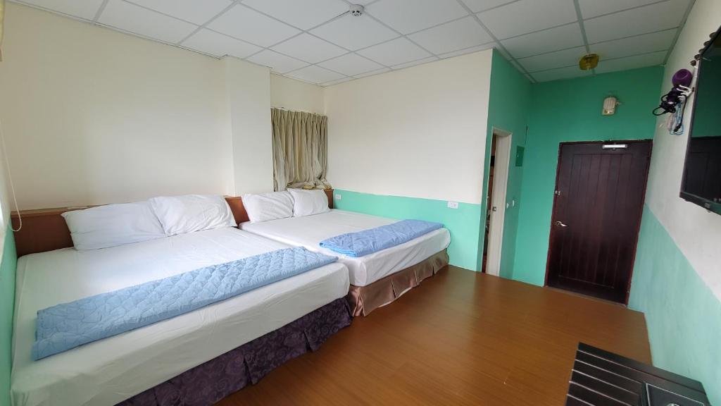 Postel nebo postele na pokoji v ubytování Lanyu Gulu Homestay