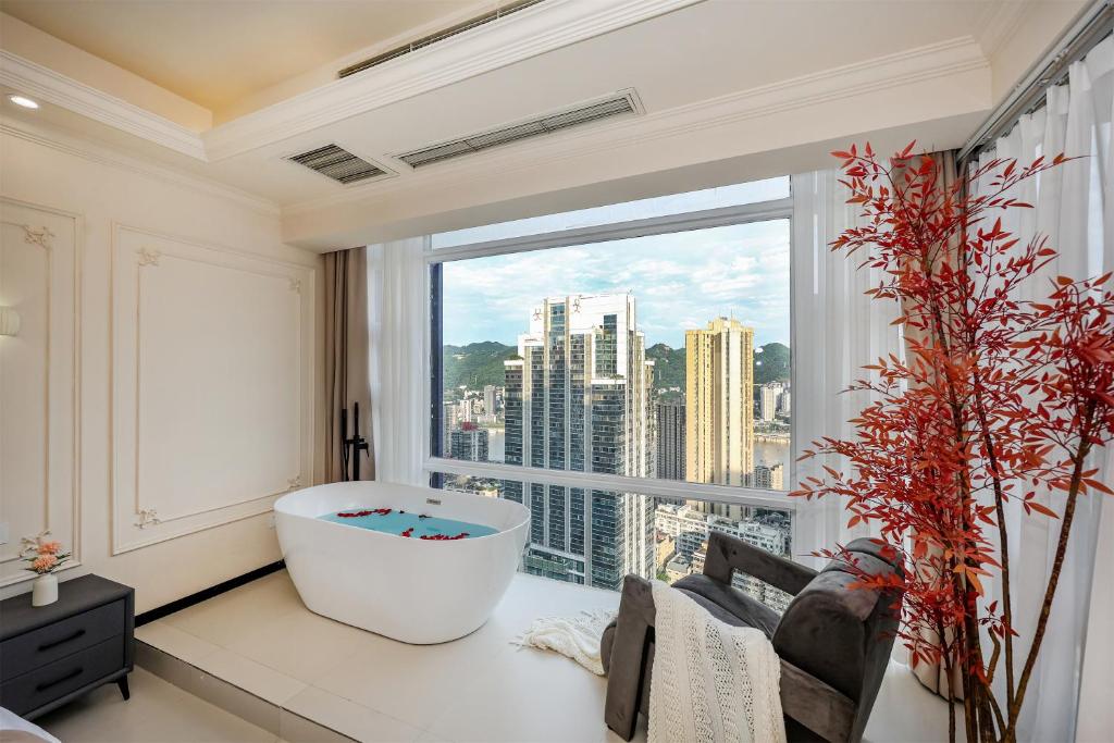 TV a/nebo společenská místnost v ubytování Baihong Riverview aparment-Chongqing Jiefangbei