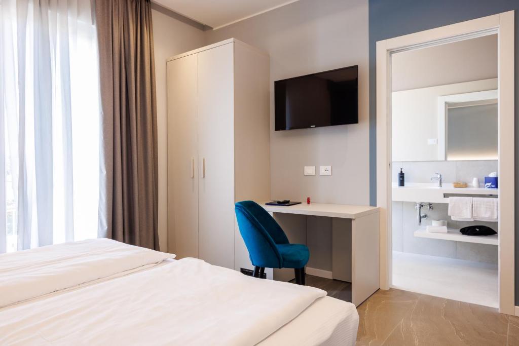 Postel nebo postele na pokoji v ubytování Hotel Paradiso
