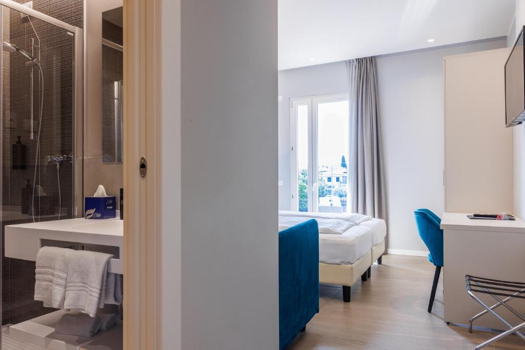 Postel nebo postele na pokoji v ubytování Hotel Paradiso