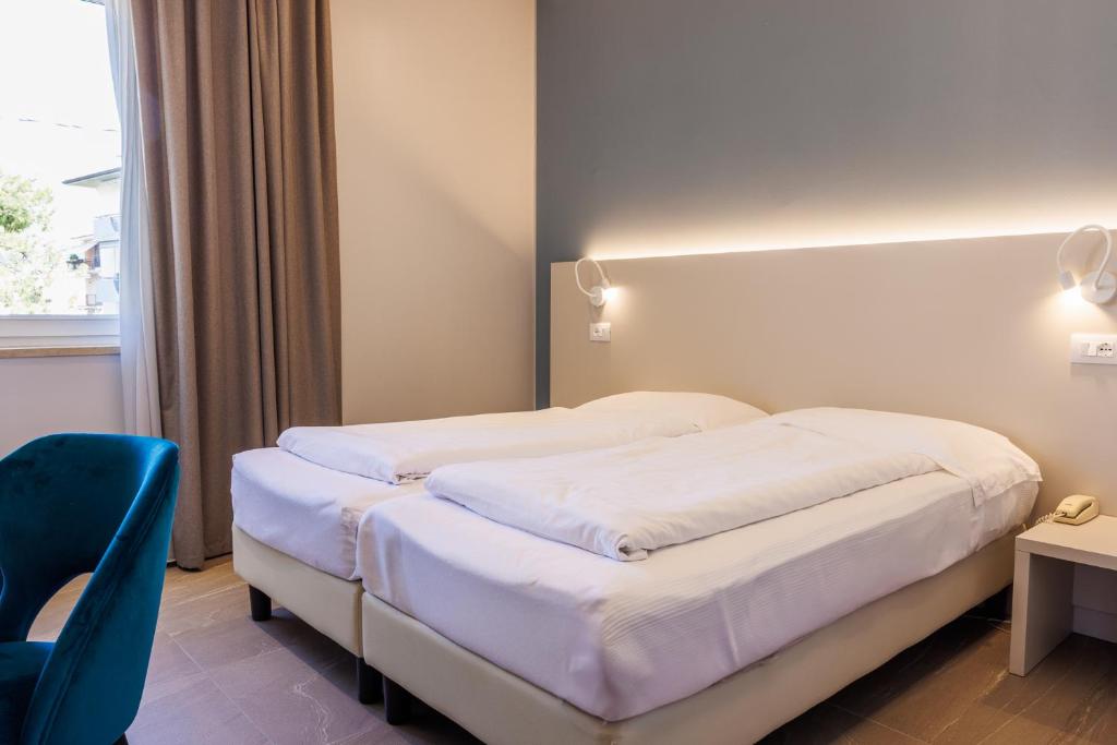 Postel nebo postele na pokoji v ubytování Hotel Paradiso