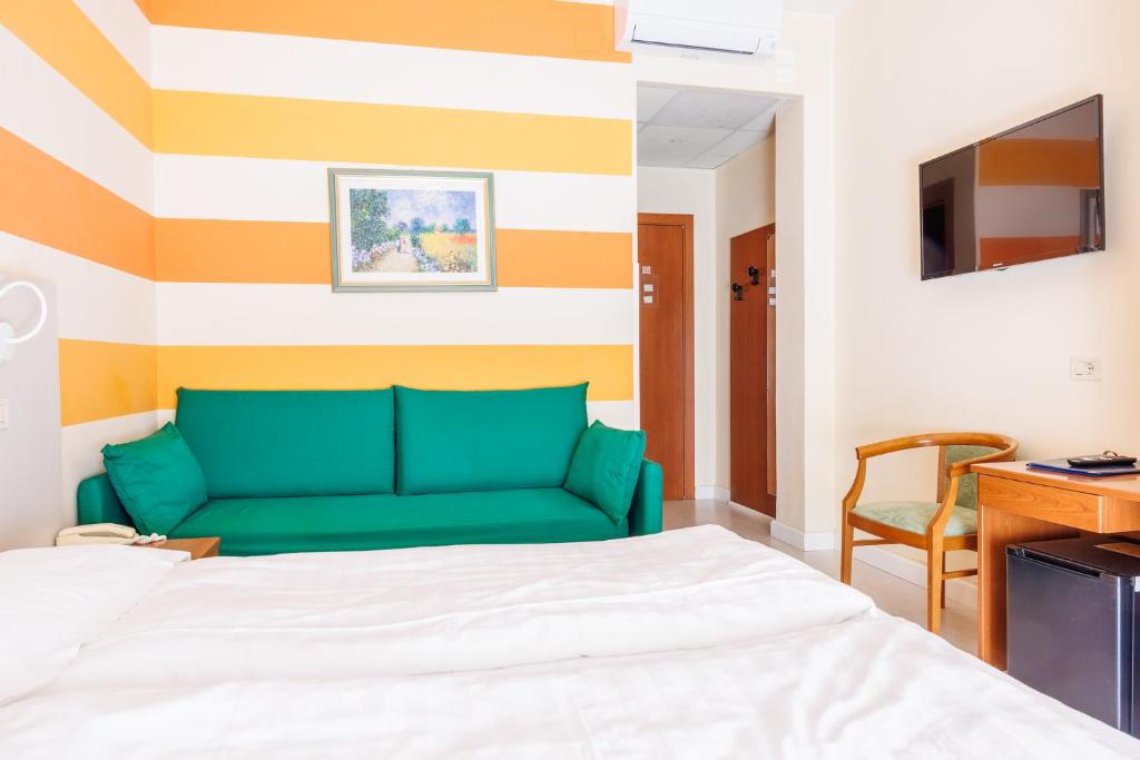 Postel nebo postele na pokoji v ubytování Hotel Paradiso
