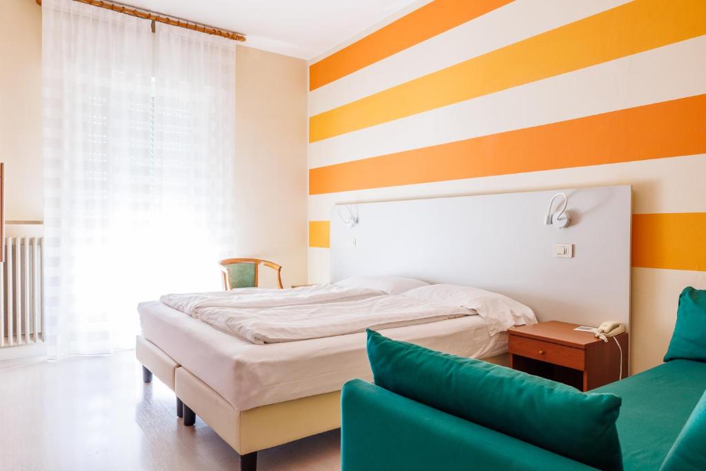 Postel nebo postele na pokoji v ubytování Hotel Paradiso