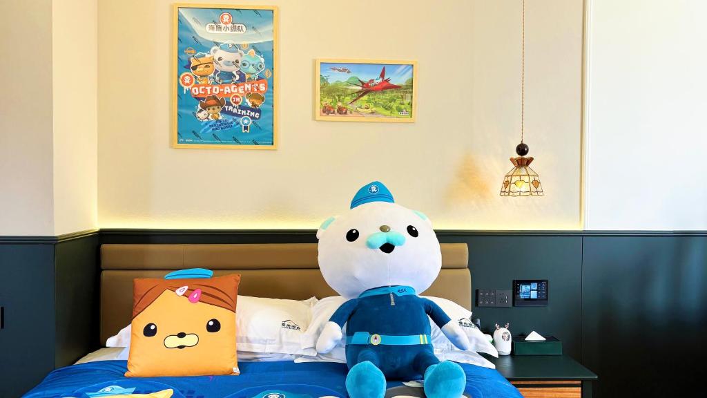 Postel nebo postele na pokoji v ubytování Vishan Garden Boutique Hotel 厦门维尚花园潮宿 中山路步行街店
