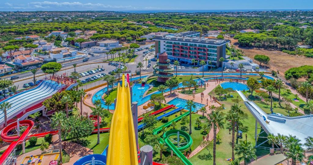 an aerial view of a water park with a roller coaster at Aquashow Park Hotel in Quarteira