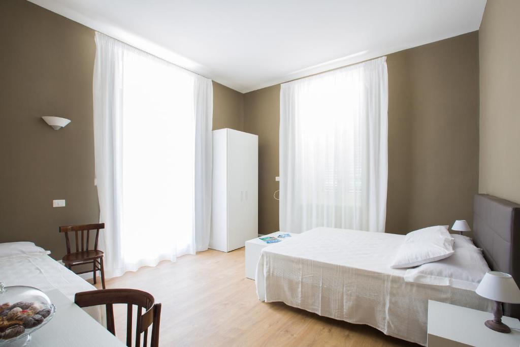 Postel nebo postele na pokoji v ubytování B&B In Centro