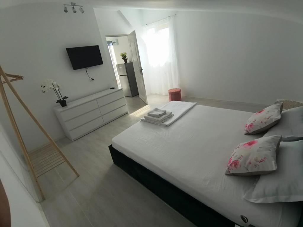 Postel nebo postele na pokoji v ubytování Casa AnaMaria
