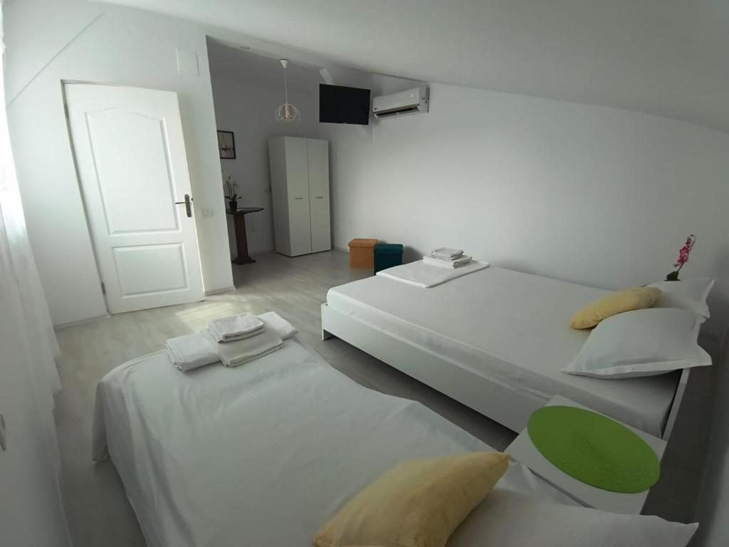 Postel nebo postele na pokoji v ubytování Casa AnaMaria
