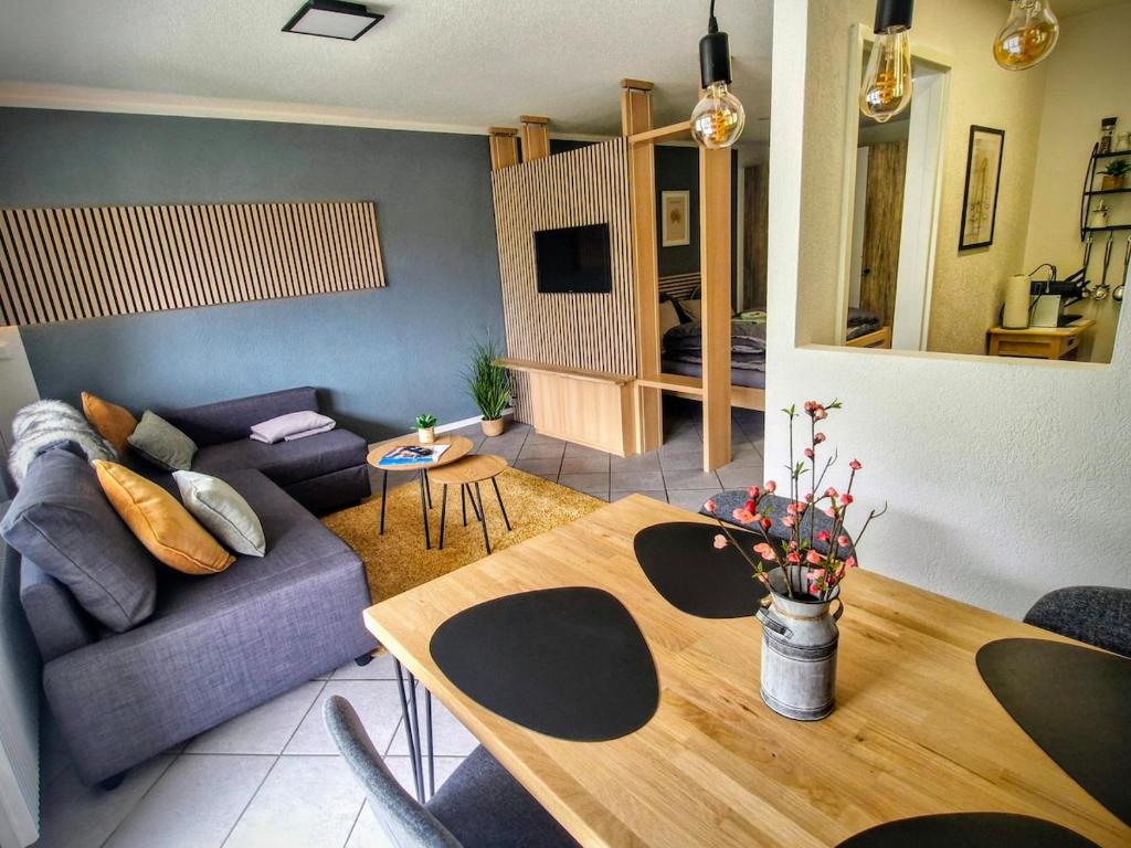 a living room with a couch and a table at Apart Weisshorn WHG 122 Valère B in Leukerbad