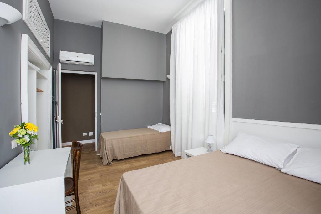 Postel nebo postele na pokoji v ubytování B&B In Centro