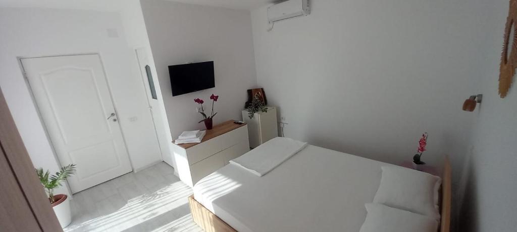 Postel nebo postele na pokoji v ubytování Casa AnaMaria