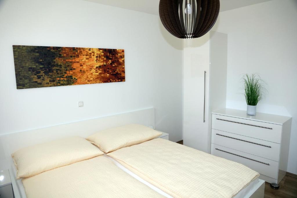 Postel nebo postele na pokoji v ubytování PENTHOUSE Griemann 2 für max 4 Personen mit eigener großer Dachterrasse zum Relaxen!