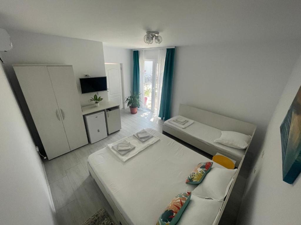 Postel nebo postele na pokoji v ubytování Casa AnaMaria