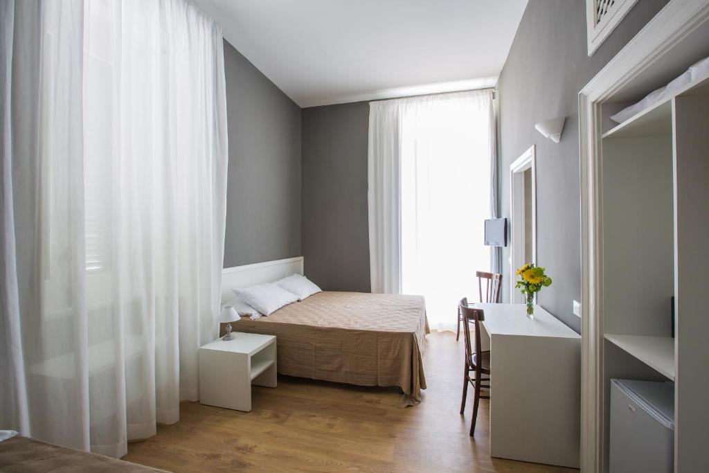 Postel nebo postele na pokoji v ubytování B&B In Centro