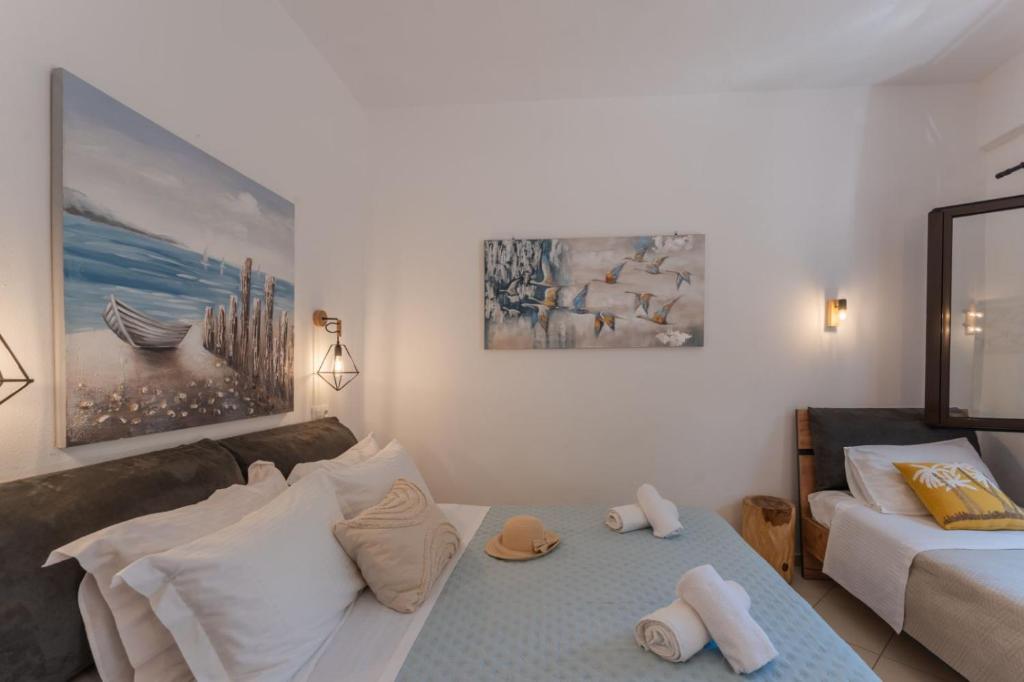 Łóżko lub łóżka w pokoju w obiekcie SKYROS AVRA Residences