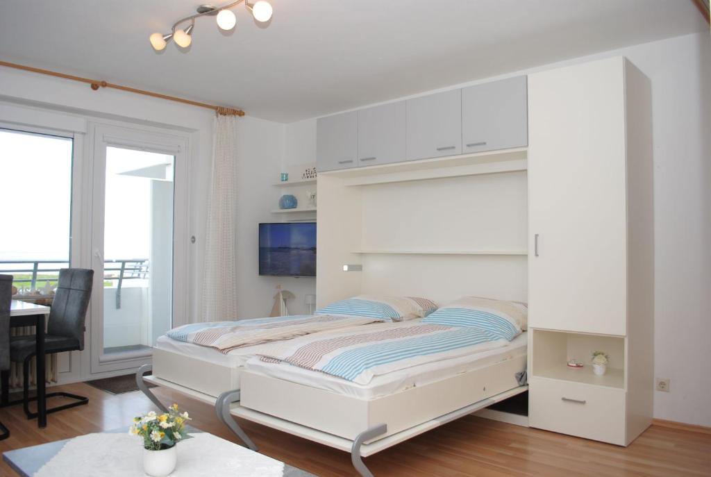 Postel nebo postele na pokoji v ubytování Haus Hanseatic, Wohnung 204