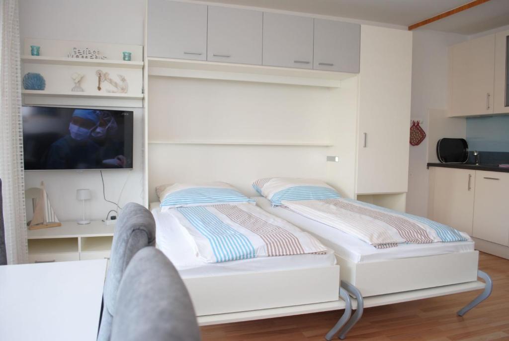 Postel nebo postele na pokoji v ubytování Haus Hanseatic, Wohnung 204